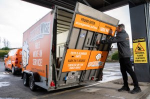 person unloading a moving truck at a storage unit for business self storage solutions