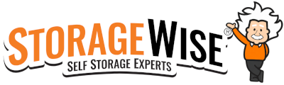 Logo for StorageWise featuring the text STORAGEWISE Self Storage Experts in orange and black, with a cartoon character resembling Einstein, smiling and waving, standing to the right of the text.